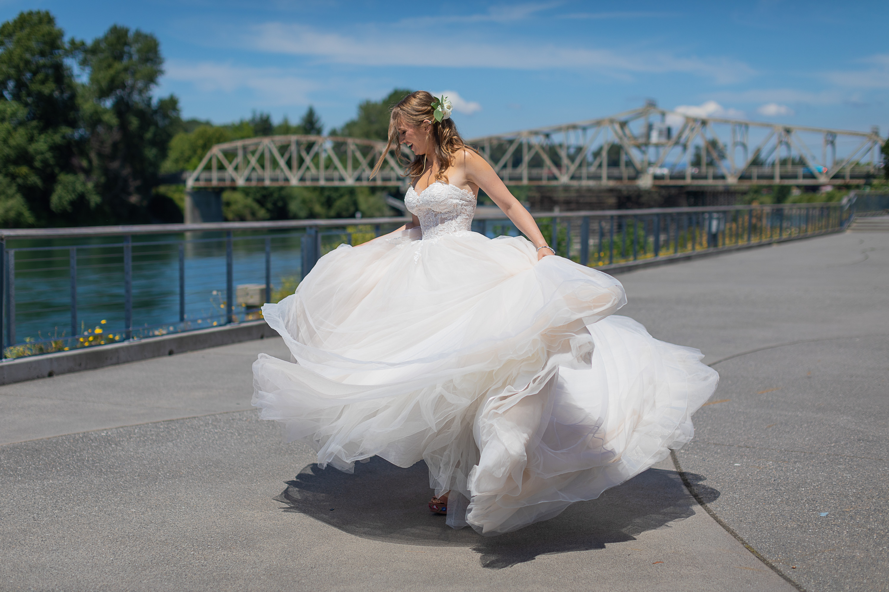Astraea Bride Spinning her ballgown on the Skagit Riverwalk Plaza