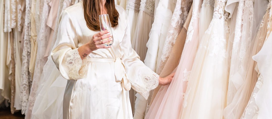 Bride going through racks at her private appointment